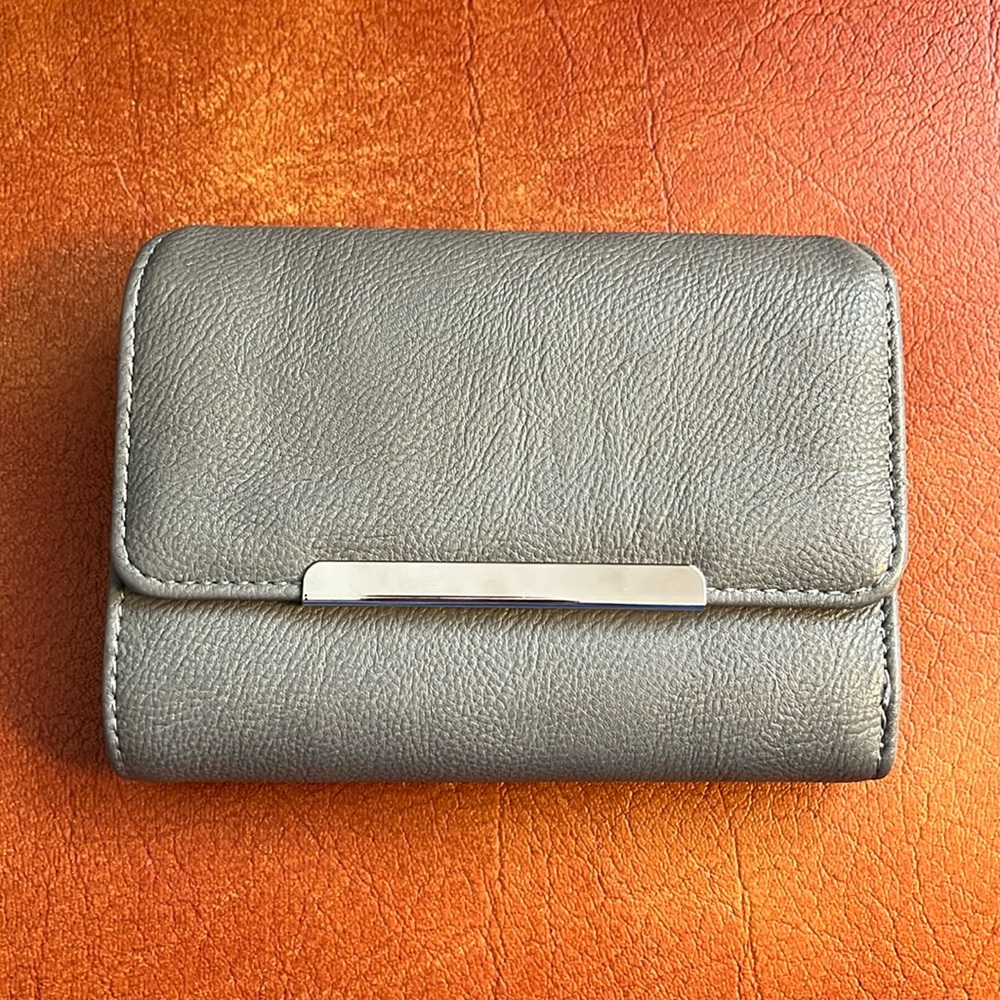 Safe Keeper brand gray, sleek women’s wallet. Excellent condition.
